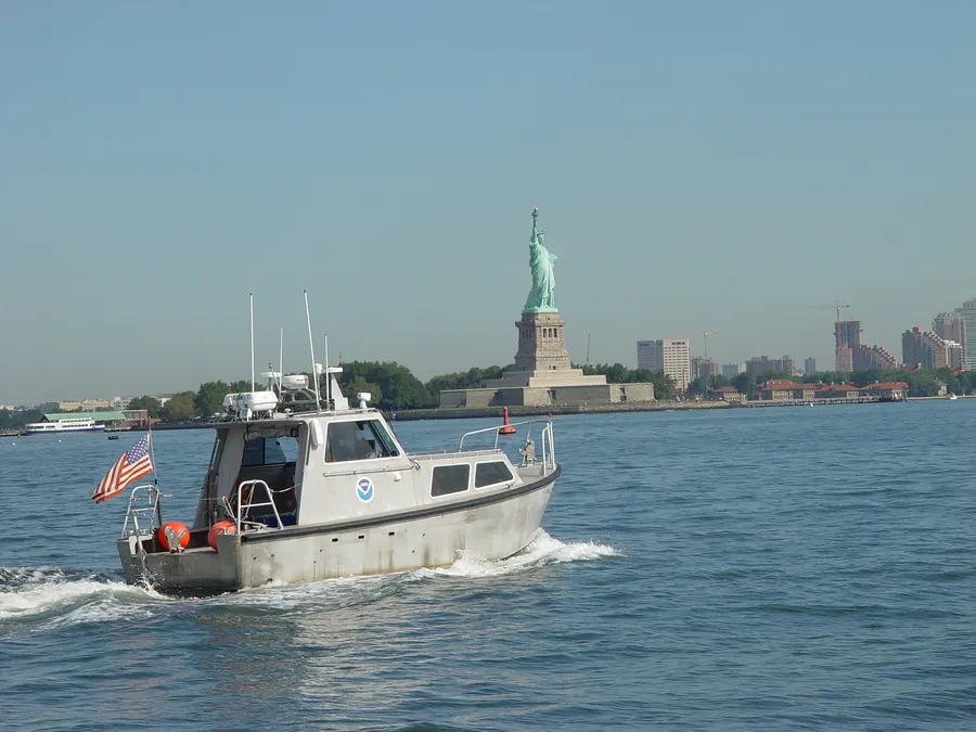 A hydrographic survey launch operating near a harbor